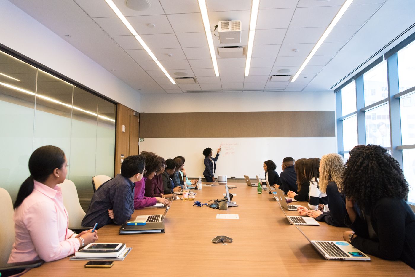 People in a meeting room working through a plan