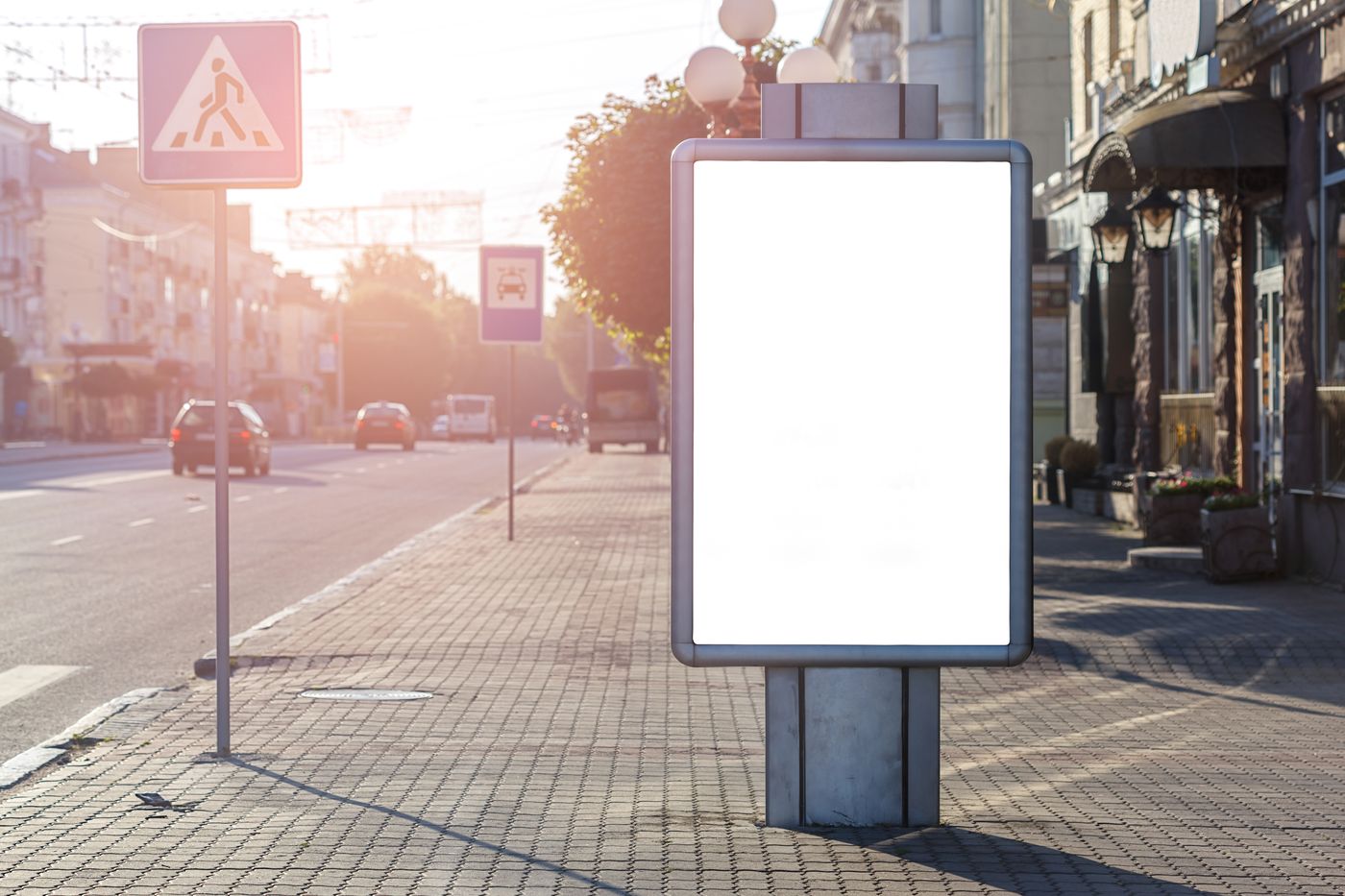A blank roadside advertising panel on a city pavement